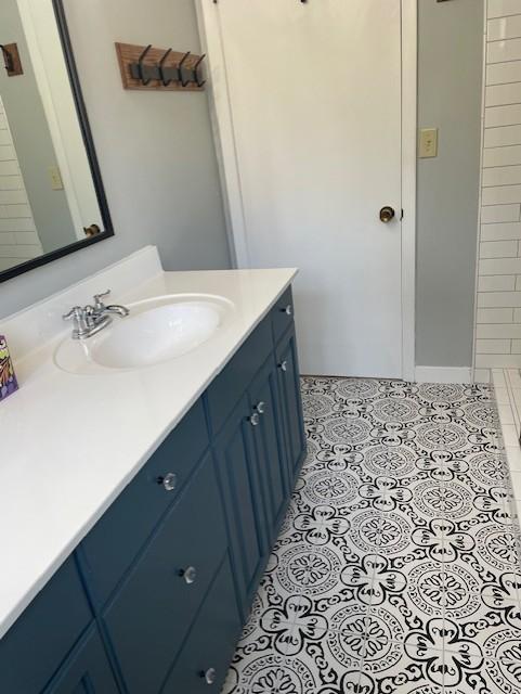 bathroom with vanity and tile patterned floors