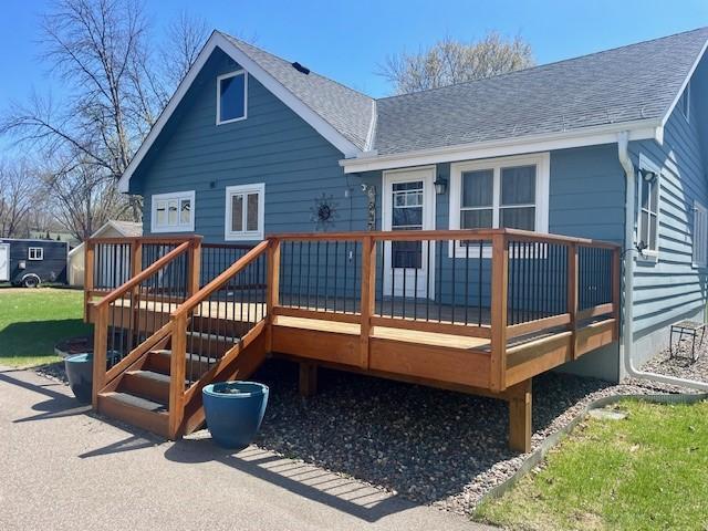 5475 Main St W, Maple Plain, MN 55359 - rear view of house featuring roof with shingles and a wooden deck