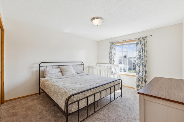 bedroom featuring baseboards and light carpet