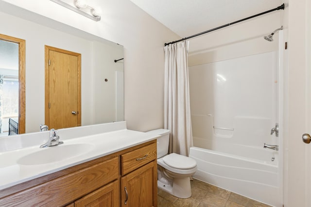 bathroom featuring vanity, toilet, and shower / tub combo