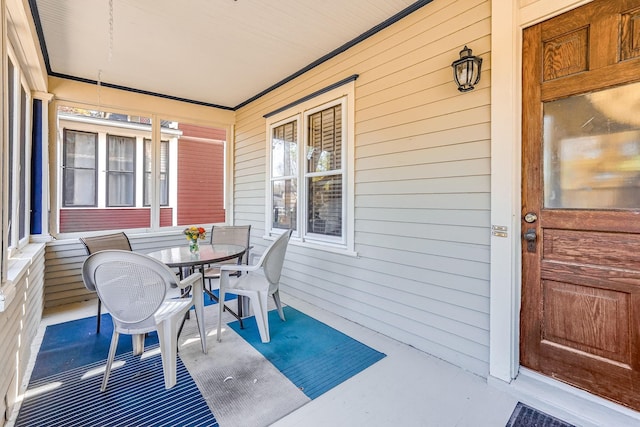 1976 Iglehart Ave, Saint Paul, MN 55104 - view of patio / terrace with a porch and outdoor dining area