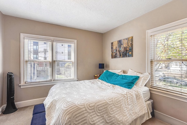 1976 Iglehart Ave, Saint Paul, MN 55104 - bedroom featuring multiple windows, baseboards, and a textured ceiling