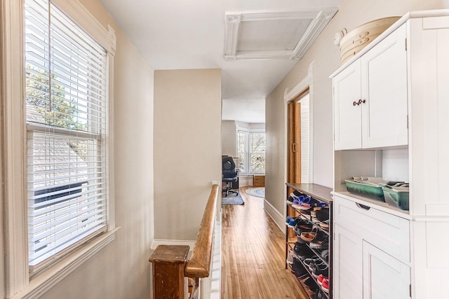1976 Iglehart Ave, Saint Paul, MN 55104 - corridor featuring light wood finished floors, baseboards, and attic access