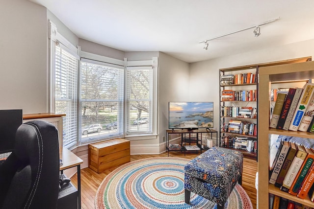 1976 Iglehart Ave, Saint Paul, MN 55104 - office with track lighting, wood finished floors, and baseboards