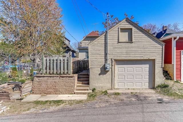 1976 Iglehart Ave, Saint Paul, MN 55104 - view of front of property with fence and a garage