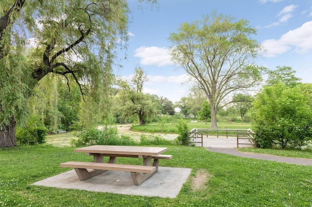 view of home's community with a lawn