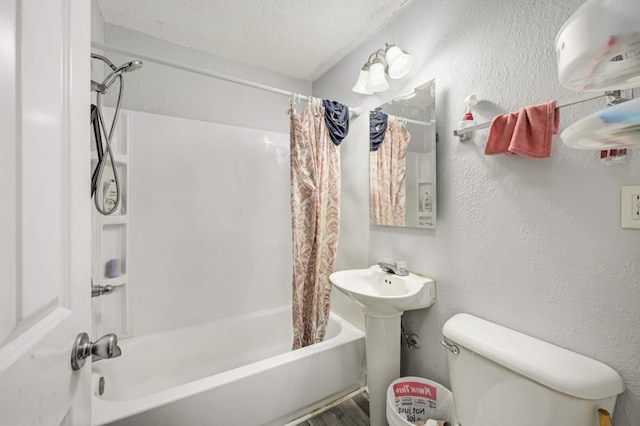 full bathroom with toilet, a textured ceiling, a textured wall, and shower / tub combo with curtain