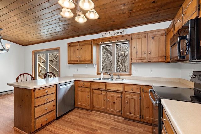 16881 169th Ave SE, Big Lake, MN 55309 - kitchen featuring stainless steel appliances, an inviting chandelier, a peninsula, and a sink