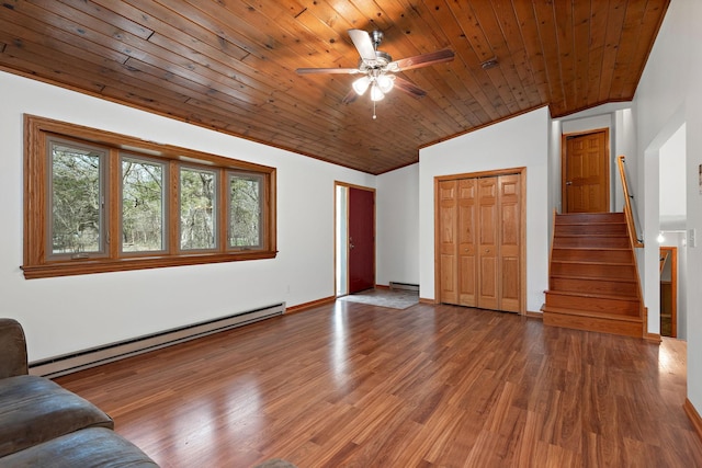 16881 169th Ave SE, Big Lake, MN 55309 - unfurnished living room with baseboard heating, stairway, wood finished floors, and lofted ceiling