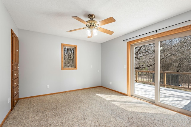 16881 169th Ave SE, Big Lake, MN 55309 - spare room featuring light colored carpet, a ceiling fan, a textured ceiling, and baseboards
