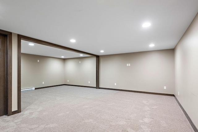 16881 169th Ave SE, Big Lake, MN 55309 - finished below grade area with baseboards, recessed lighting, light colored carpet, and a baseboard radiator