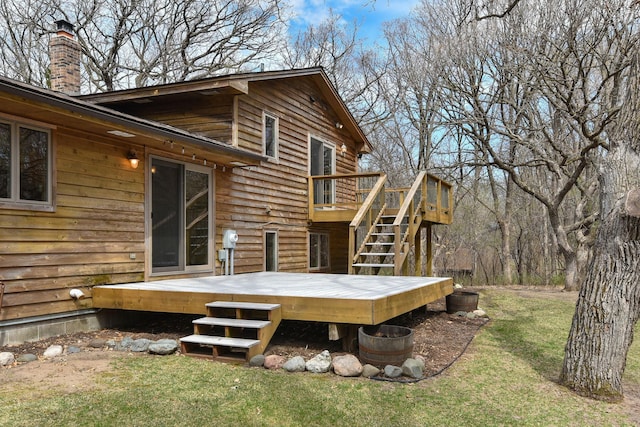16881 169th Ave SE, Big Lake, MN 55309 - back of house with a lawn, a wooden deck, stairs, and a chimney
