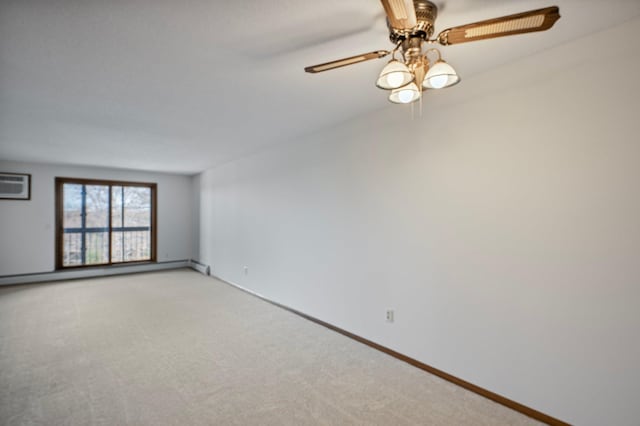 spare room with baseboards, a wall mounted air conditioner, ceiling fan, and light colored carpet