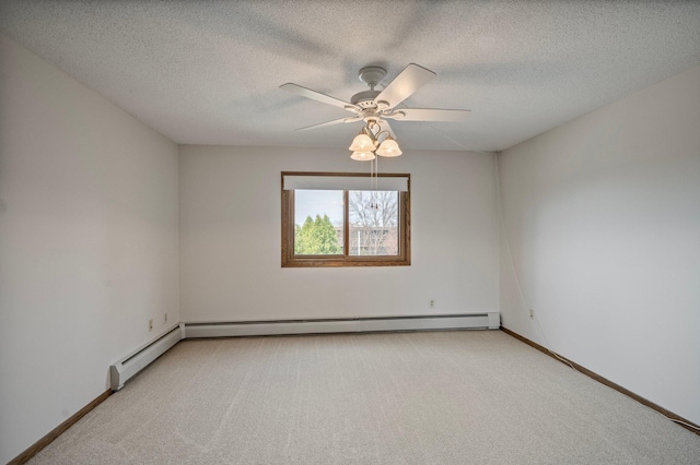 spare room with a textured ceiling, ceiling fan, a baseboard heating unit, and light carpet