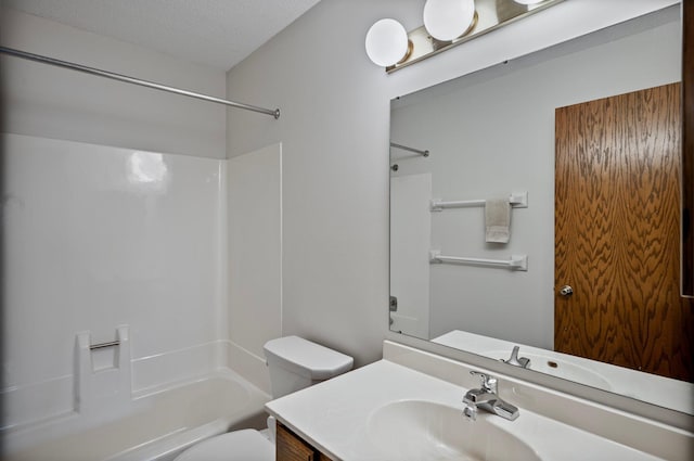 full bath with toilet, a textured ceiling, bathing tub / shower combination, and vanity