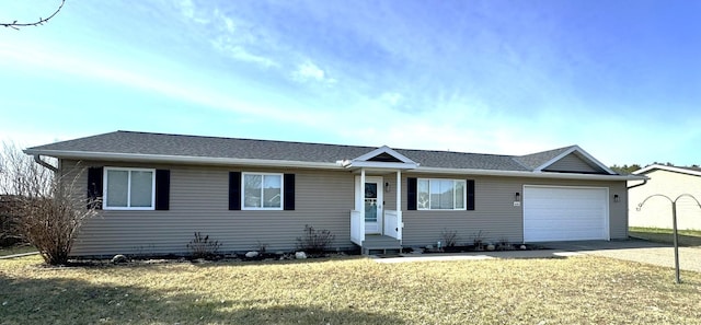 606 Tenth St W, Park Rapids, MN 56470 - ranch-style home featuring a garage, a front lawn, driveway, and roof with shingles