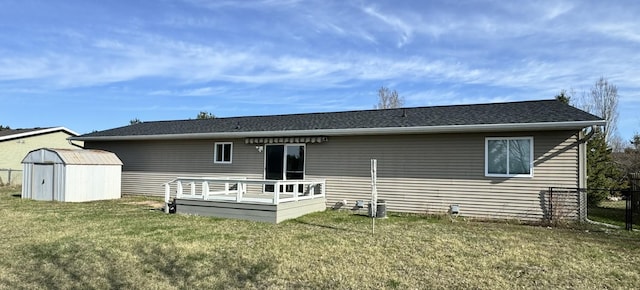 606 Tenth St W, Park Rapids, MN 56470 - rear view of property featuring a storage shed, a deck, and an outdoor structure