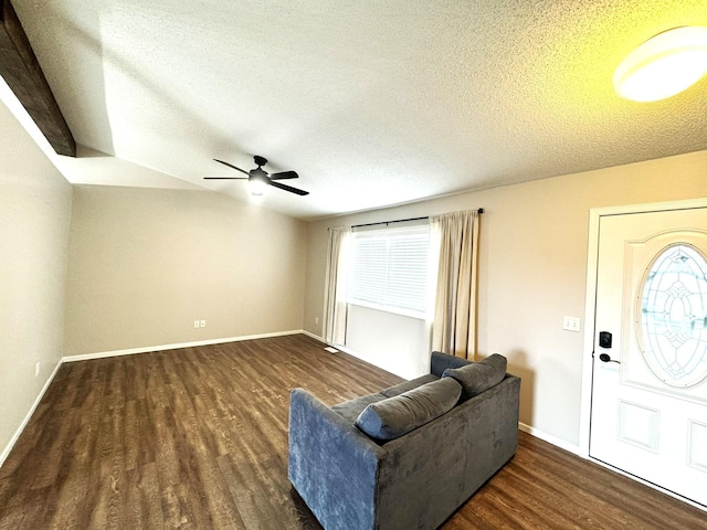 606 Tenth St W, Park Rapids, MN 56470 - living area with wood finished floors, a textured ceiling, ceiling fan, and baseboards