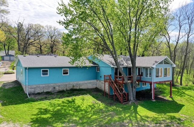 12056 Everton Ave N, Hugo, MN 55110 - back of property featuring stairway, roof with shingles, a lawn, and a deck