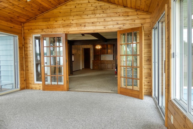 12056 Everton Ave N, Hugo, MN 55110 - empty room featuring vaulted ceiling, wood walls, carpet, and wooden ceiling