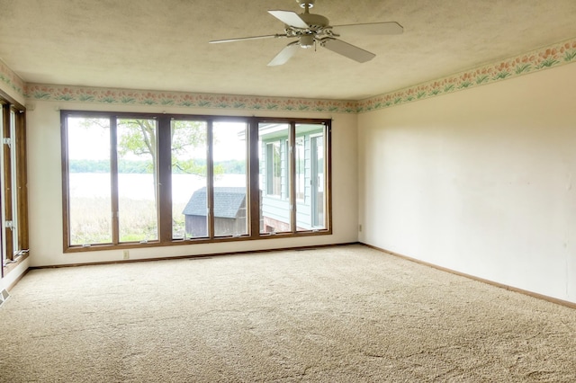 12056 Everton Ave N, Hugo, MN 55110 - unfurnished room featuring baseboards, carpet floors, and ceiling fan
