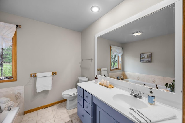 1171 County Rd E, Scott Twp, WI 54801 - bathroom featuring a garden tub, a healthy amount of sunlight, and toilet
