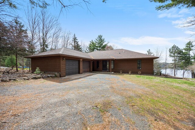 1171 County Rd E, Scott Twp, WI 54801 - view of front facade featuring roof with shingles, an attached garage, and driveway
