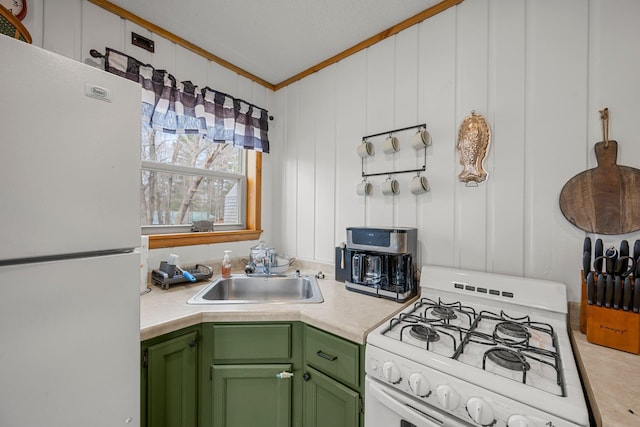 1171 County Rd E, Scott Twp, WI 54801 - kitchen with crown molding, a sink, light countertops, green cabinetry, and white appliances