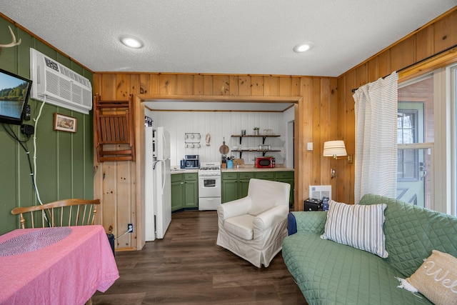 1171 County Rd E, Scott Twp, WI 54801 - interior space featuring freestanding refrigerator, wood walls, dark wood-type flooring, a textured ceiling, and a wall unit AC