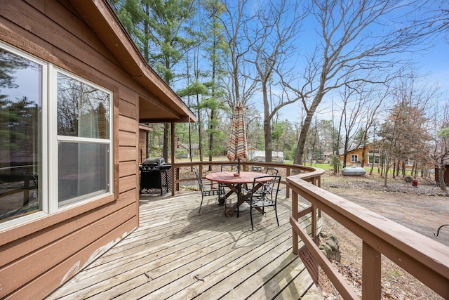 1171 County Rd E, Scott Twp, WI 54801 - deck featuring a grill and outdoor dining space