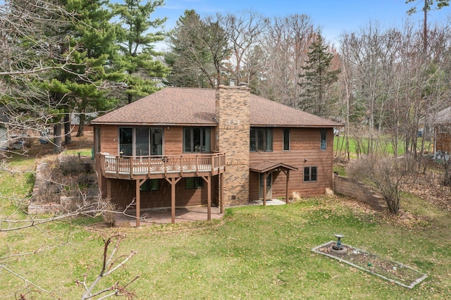 1171 County Rd E, Scott Twp, WI 54801 - back of property featuring a chimney, a lawn, a deck, a patio, and a shingled roof