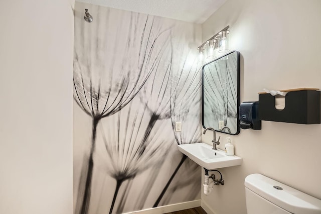 half bath featuring toilet