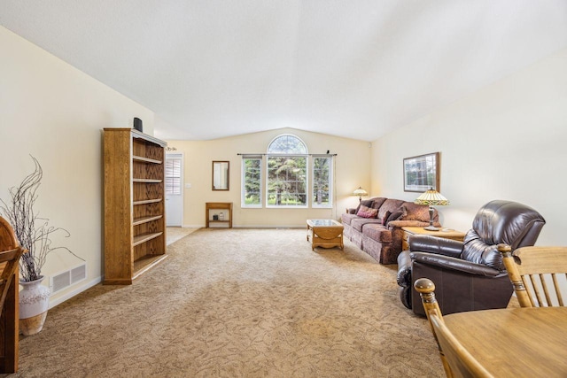 living area featuring lofted ceiling, carpet, and baseboards