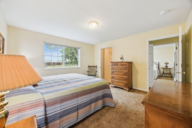 carpeted bedroom featuring a textured ceiling