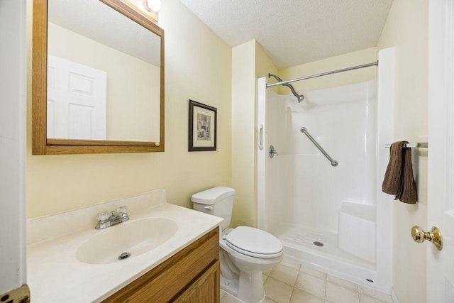 full bathroom with a shower, a textured ceiling, vanity, toilet, and tile patterned floors