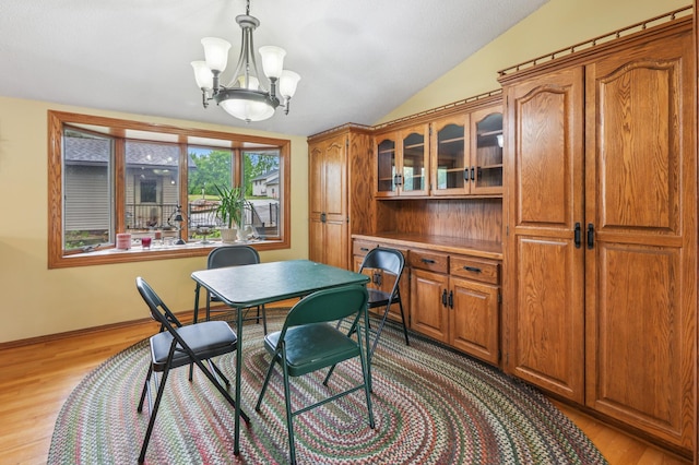 2060 Donnelly Dr NW, Maple Lake Twp, MN 55313 - dining space with lofted ceiling, light wood-type flooring, a chandelier, a desk, and baseboards