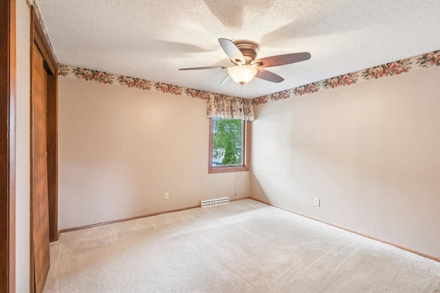 2060 Donnelly Dr NW, Maple Lake Twp, MN 55313 - spare room featuring a ceiling fan, light colored carpet, baseboards, and a textured ceiling