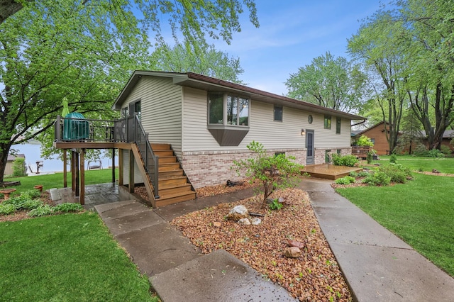 2060 Donnelly Dr NW, Maple Lake Twp, MN 55313 - view of front of home featuring a wooden deck, a front lawn, stairs, and brick siding
