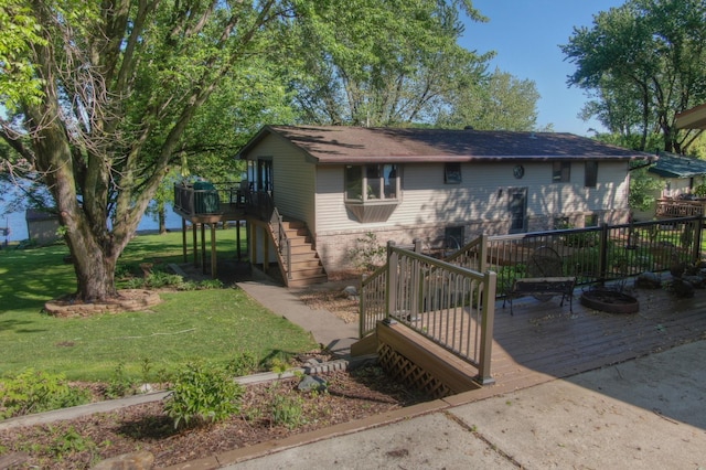 2060 Donnelly Dr NW, Maple Lake Twp, MN 55313 - view of front of property with stairs, a wooden deck, brick siding, and a front lawn
