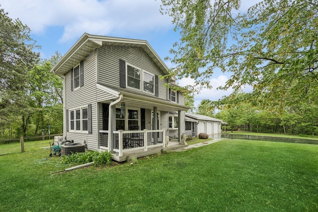 18701 Delton Ave, Minnetonka, MN 55345 - rear view of property featuring covered porch, cooling unit, and a garage