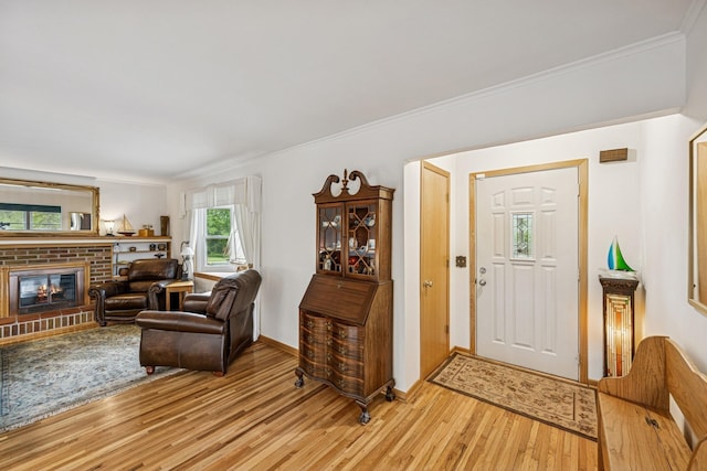 18701 Delton Ave, Minnetonka, MN 55345 - foyer with light wood finished floors, ornamental molding, a fireplace, and baseboards