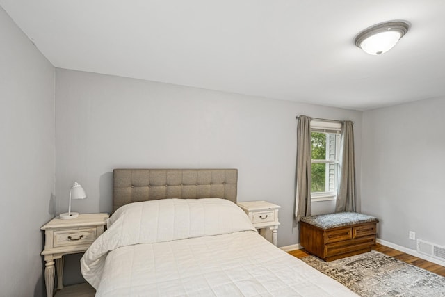18701 Delton Ave, Minnetonka, MN 55345 - bedroom featuring wood finished floors and baseboards