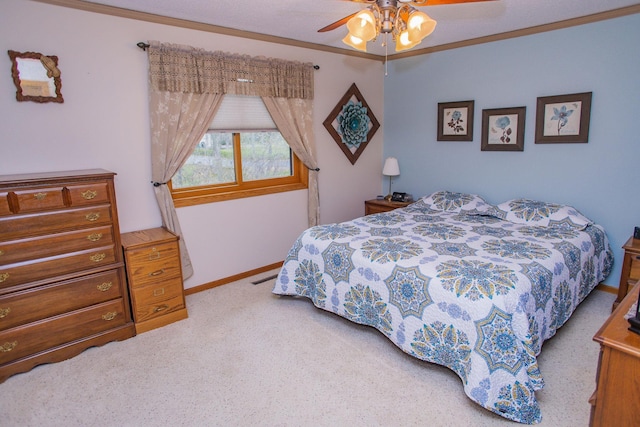 bedroom featuring baseboards, visible vents, a ceiling fan, and carpet