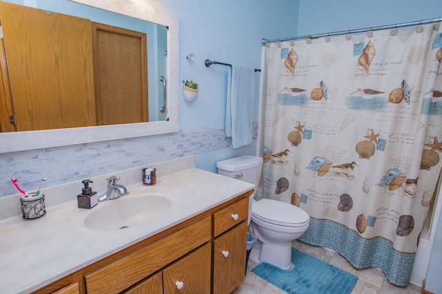 bathroom featuring toilet, curtained shower, backsplash, and vanity