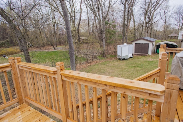 deck with a lawn, an outbuilding, and a garage