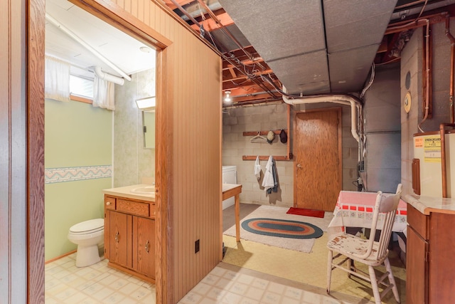 below grade area with light floors and a sink