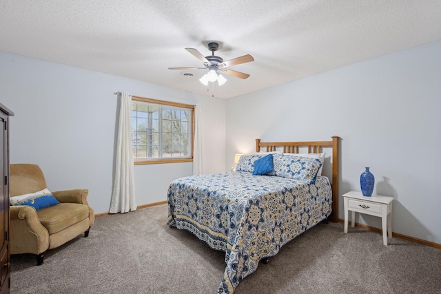 bedroom with carpet floors, baseboards, a ceiling fan, and a textured ceiling