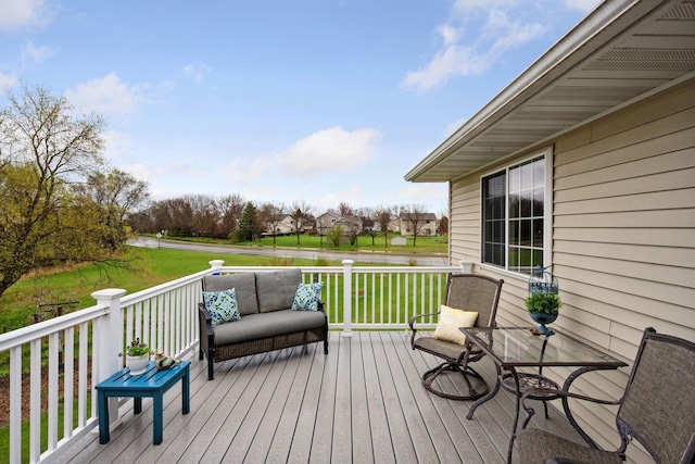 wooden terrace with a lawn