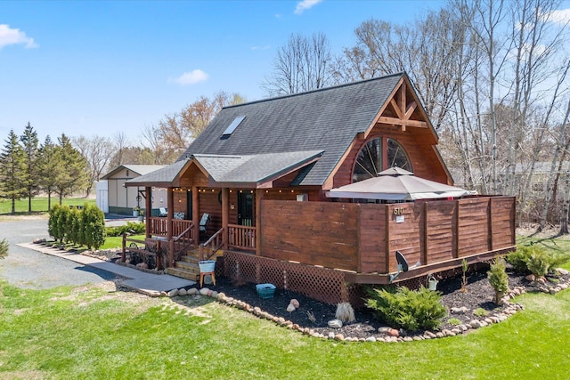 510 State Rd Unit 35, Centuria, WI 54024 - rear view of house with a shingled roof, a yard, and a porch