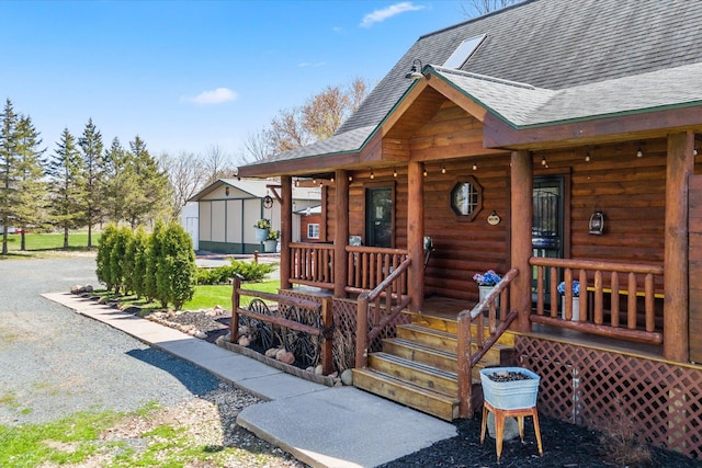 510 State Rd Unit 35, Centuria, WI 54024 - property entrance with roof with shingles and covered porch
